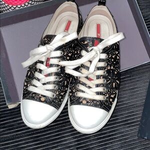 Prada woman’s sneakers with black tan contrasting tooled design